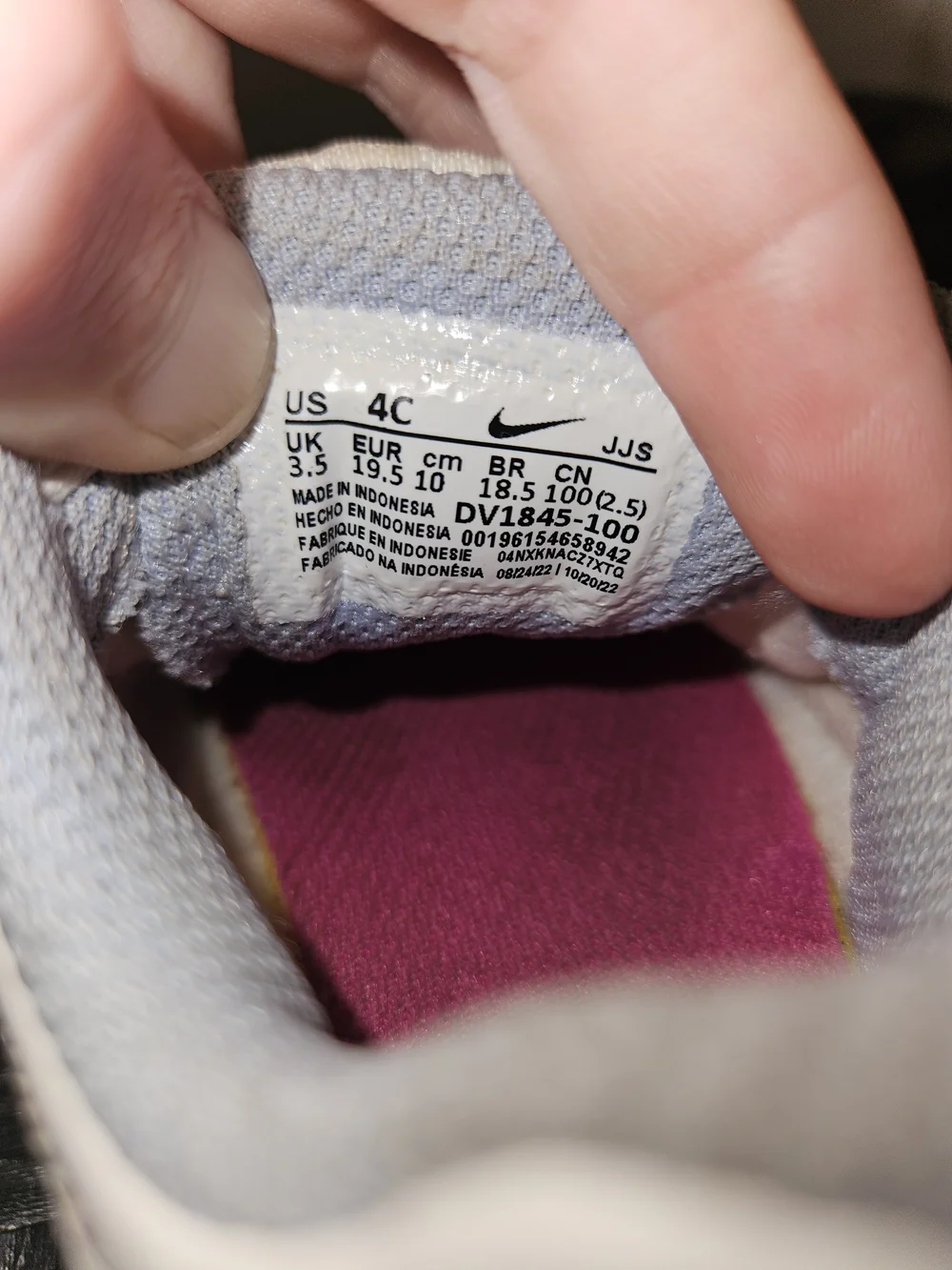 Nike White Toddler Sneakers with Pink, Blue & Purple Accents